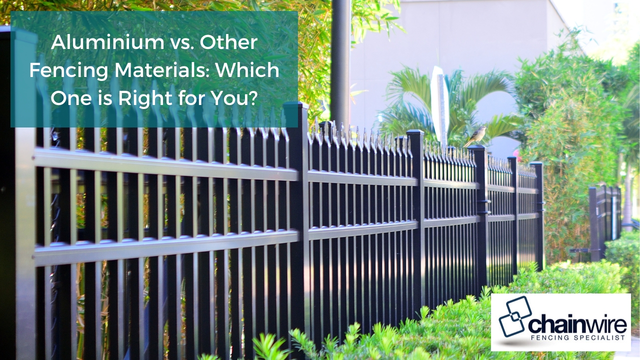 Aluminium fencing with pointed tops, surrounded by lush greenery, ideal for residential and commercial properties.