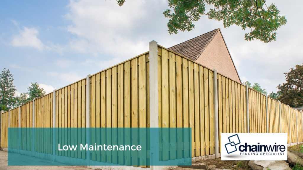 Tall wooden fencing with concrete posts, offering durable privacy and security for residential properties