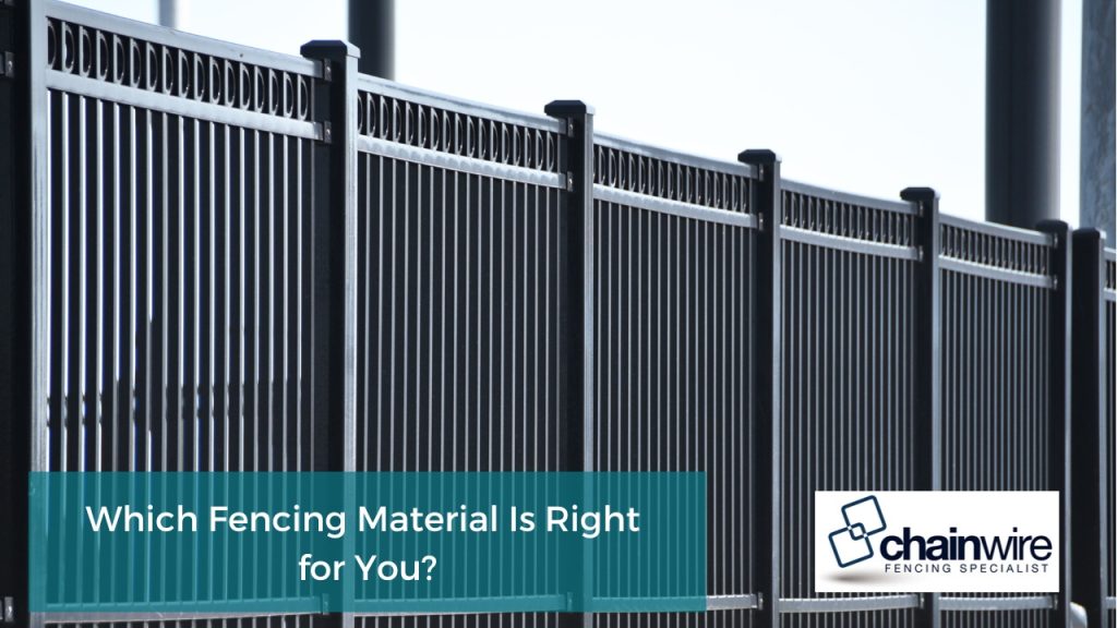 Modern black metal fencing with vertical bars and decorative top, perfect for high-security applications.