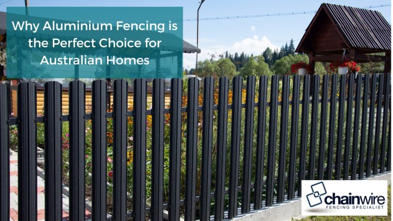Elegant black aluminum fencing securing a tranquil backyard retreat, perfect for unwinding with a glass of wine amidst colorful flowers.